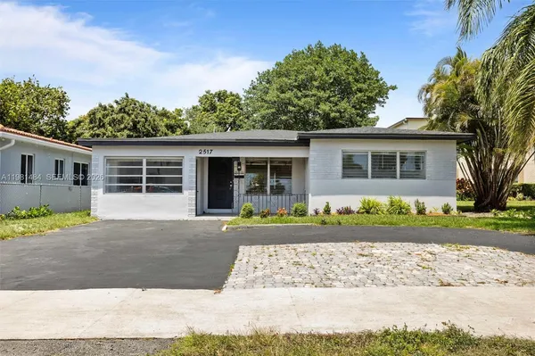 front view of a house with a yard