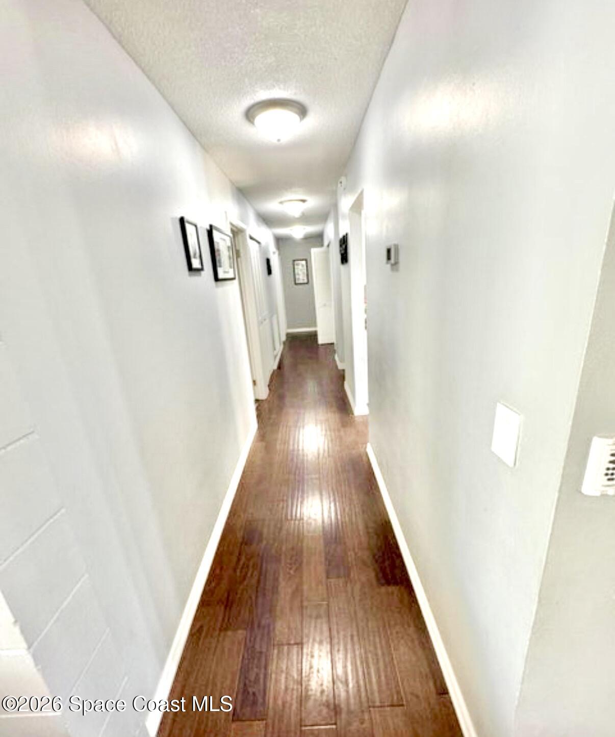 938 Brunswick Lane Rockledge, FL 32955 - Photo 4 of 21 Hallway to bedrooms and guest bath