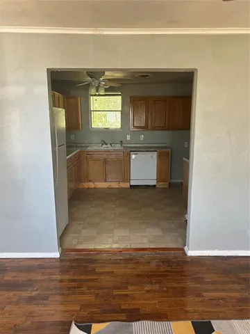 a view of a kitchen from the hallway
