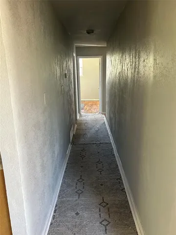 a view of hallway with stairs