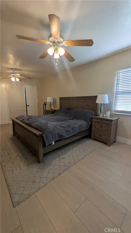 a bedroom with a bed and window