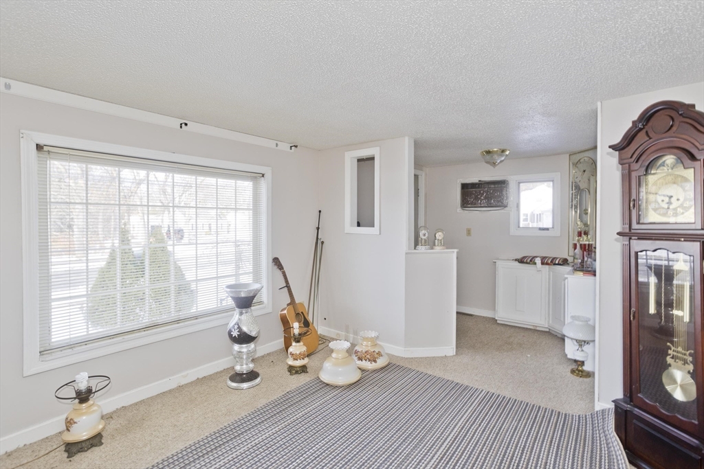 647 Plumtree Road Springfield, MA 01118 - Photo 6 of 23 a living room with furniture and a window