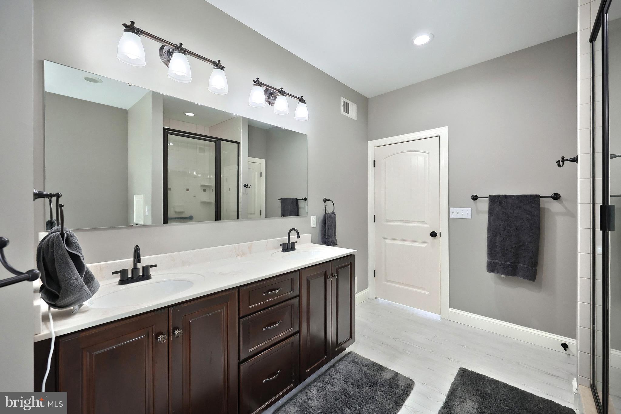 4440 Beards School Road Spring Grove, PA 17362 - Photo 13 of 66 a spacious bathroom with a double vanity sink and mirror