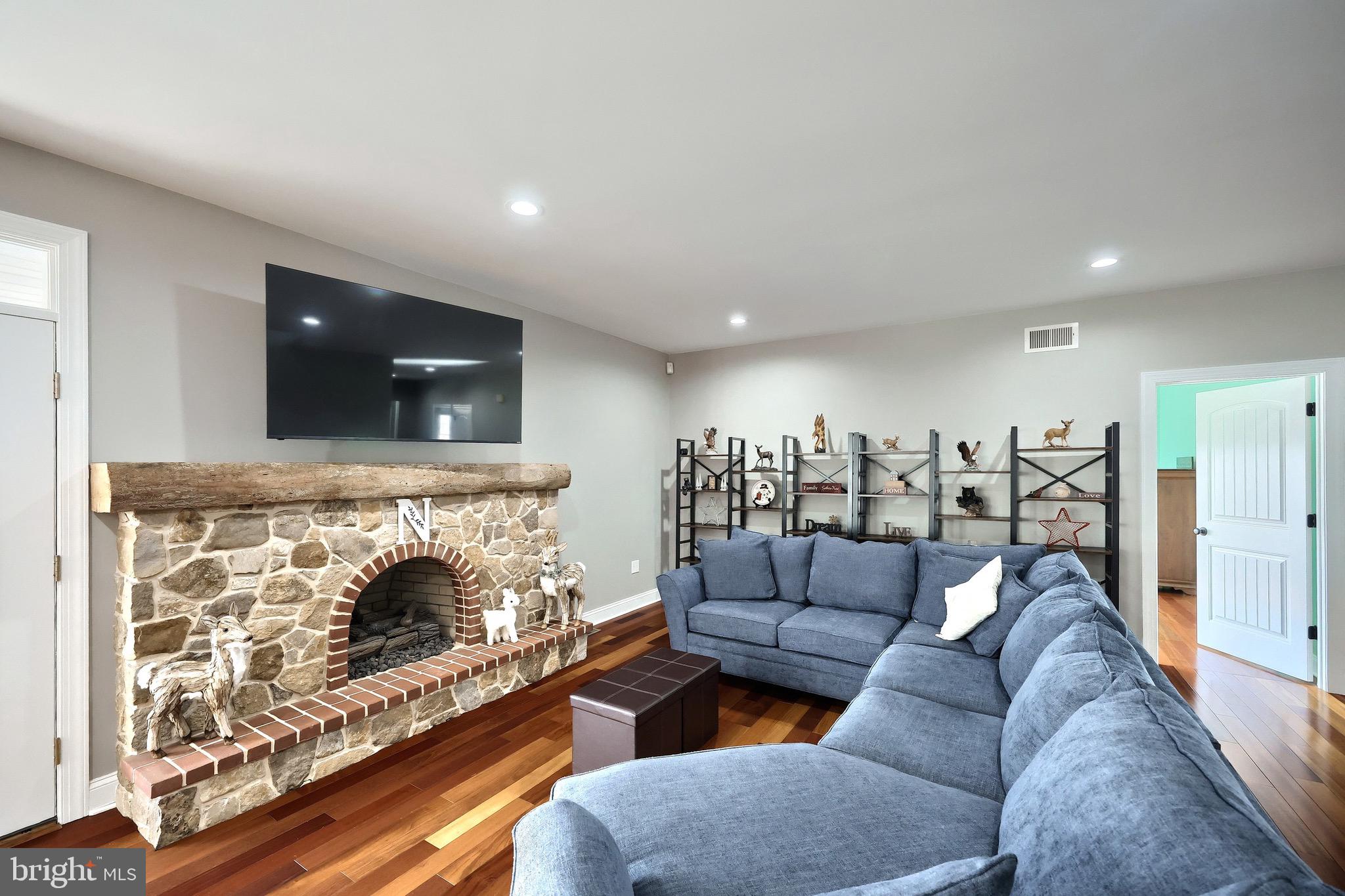 4440 Beards School Road Spring Grove, PA 17362 - Photo 14 of 66 a living room with furniture and a fireplace