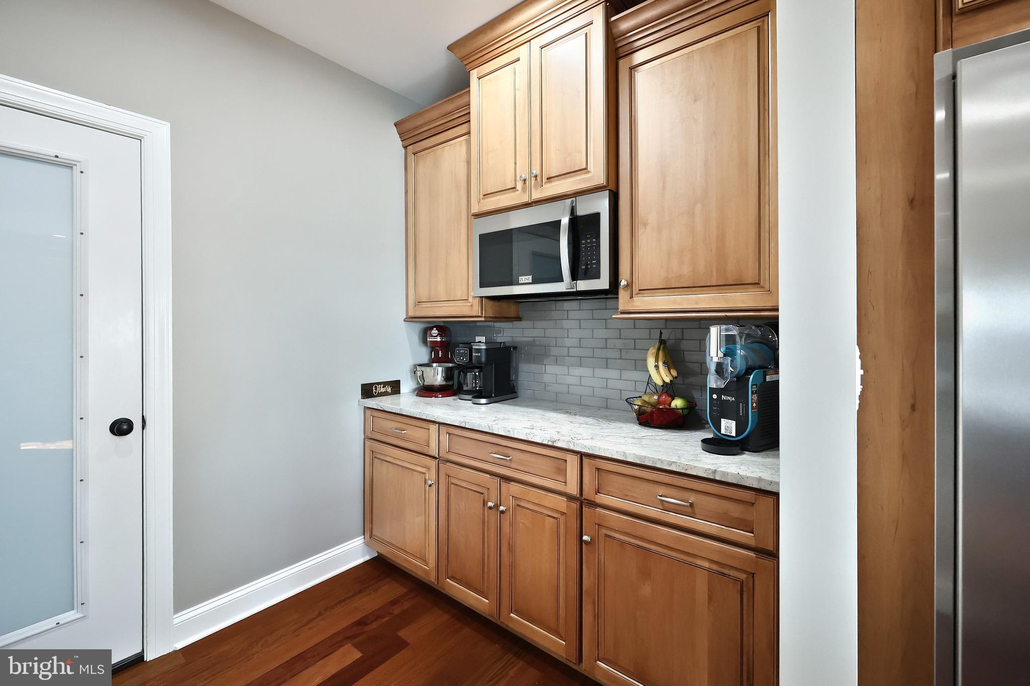 4440 Beards School Road Spring Grove, PA 17362 - Photo 21 of 66 a kitchen with stainless steel appliances granite countertop a refrigerator a microwave and oven