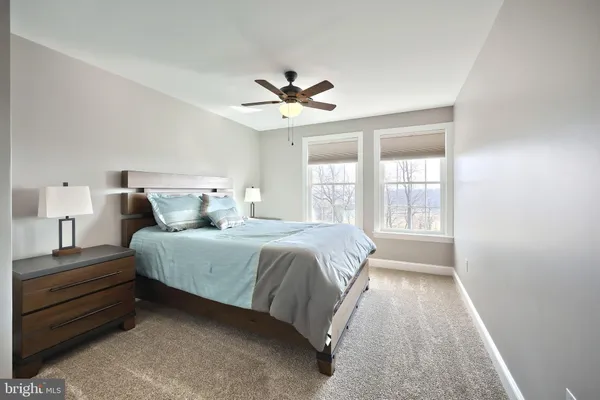 a view of a room with table and chairs