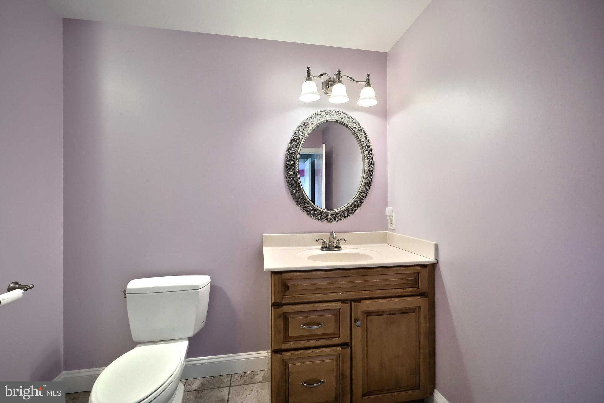 4440 Beards School Road Spring Grove, PA 17362 - Photo 33 of 66 a bathroom with a toilet sink vanity and mirror