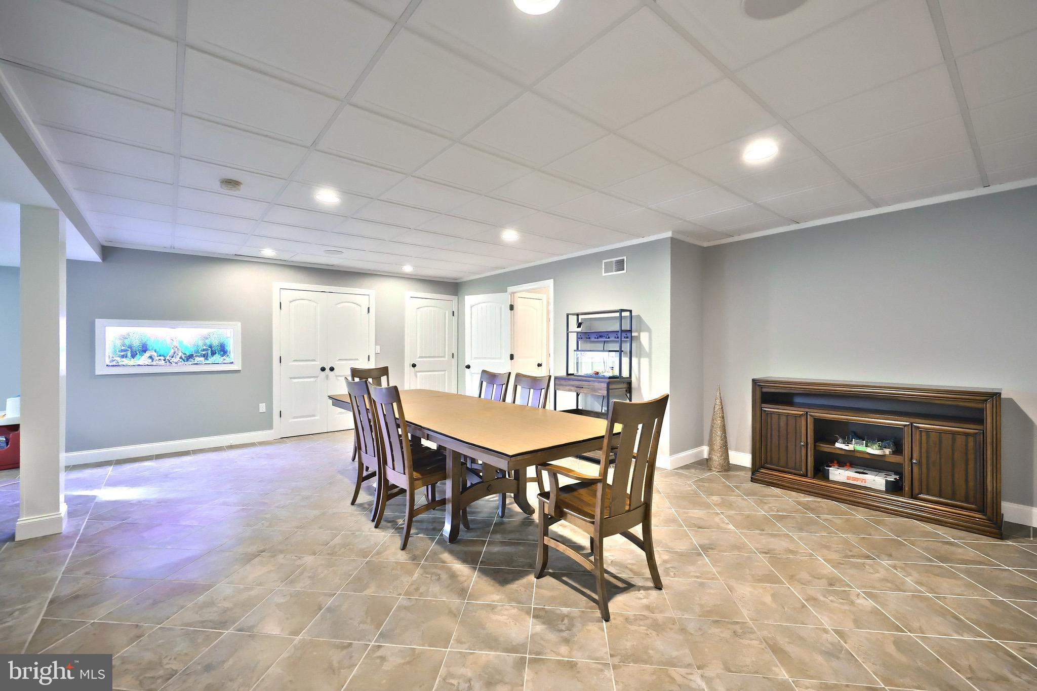 4440 Beards School Road Spring Grove, PA 17362 - Photo 37 of 66 a dining room with a wooden table and a fireplace