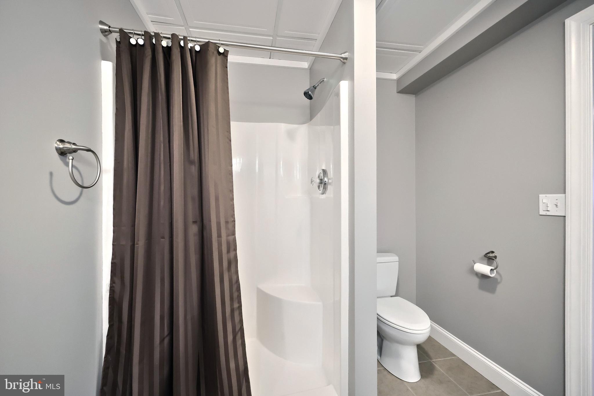 4440 Beards School Road Spring Grove, PA 17362 - Photo 41 of 66 a bathroom with a shower a toilet and a sink