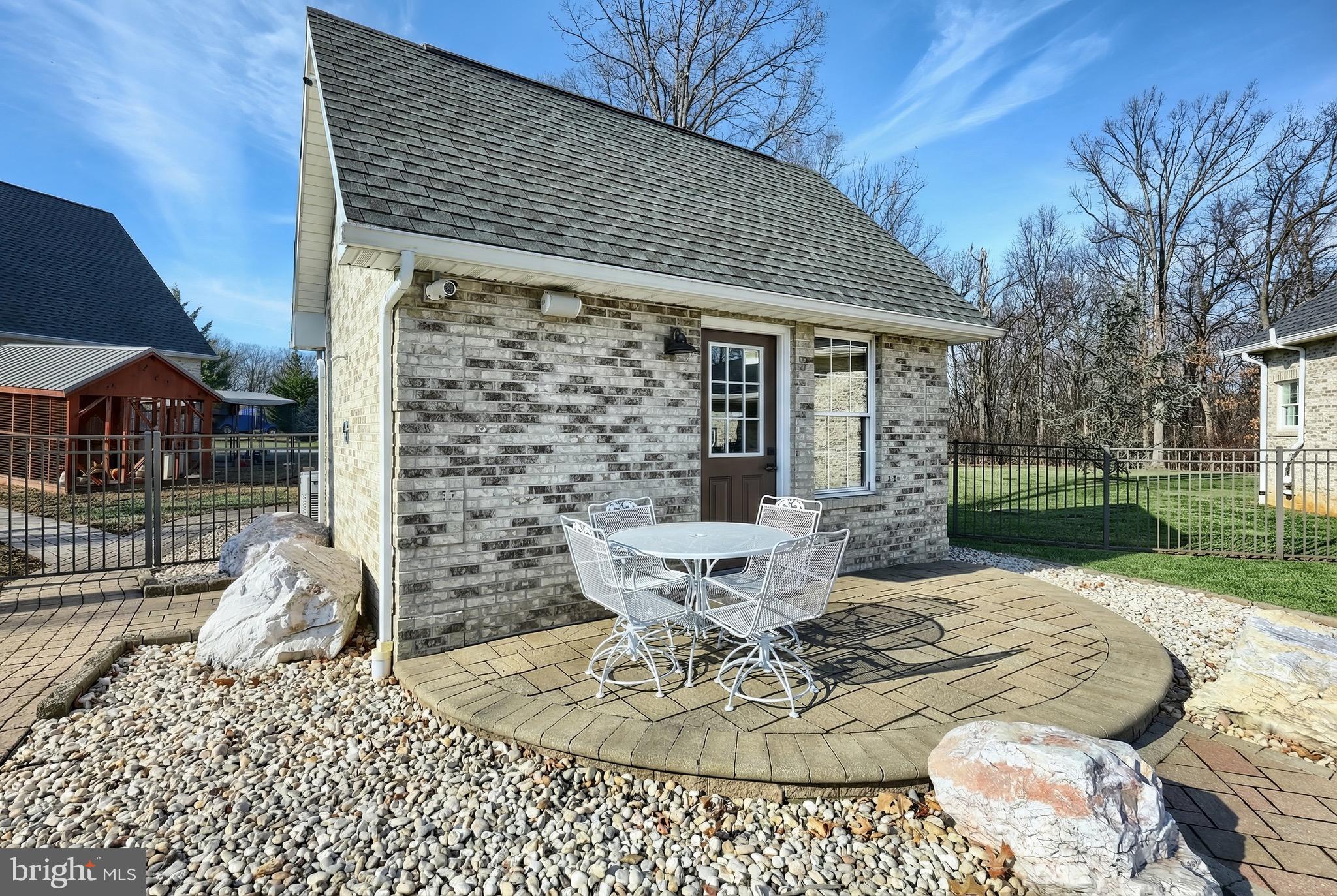 4440 Beards School Road Spring Grove, PA 17362 - Photo 54 of 66 a view of a patio with table and chairs and potted plants