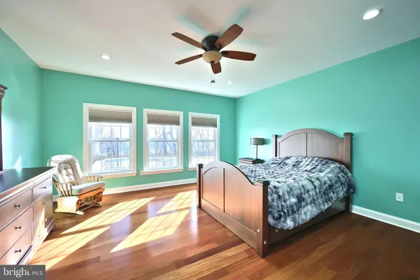 a white toilet sitting next to a window