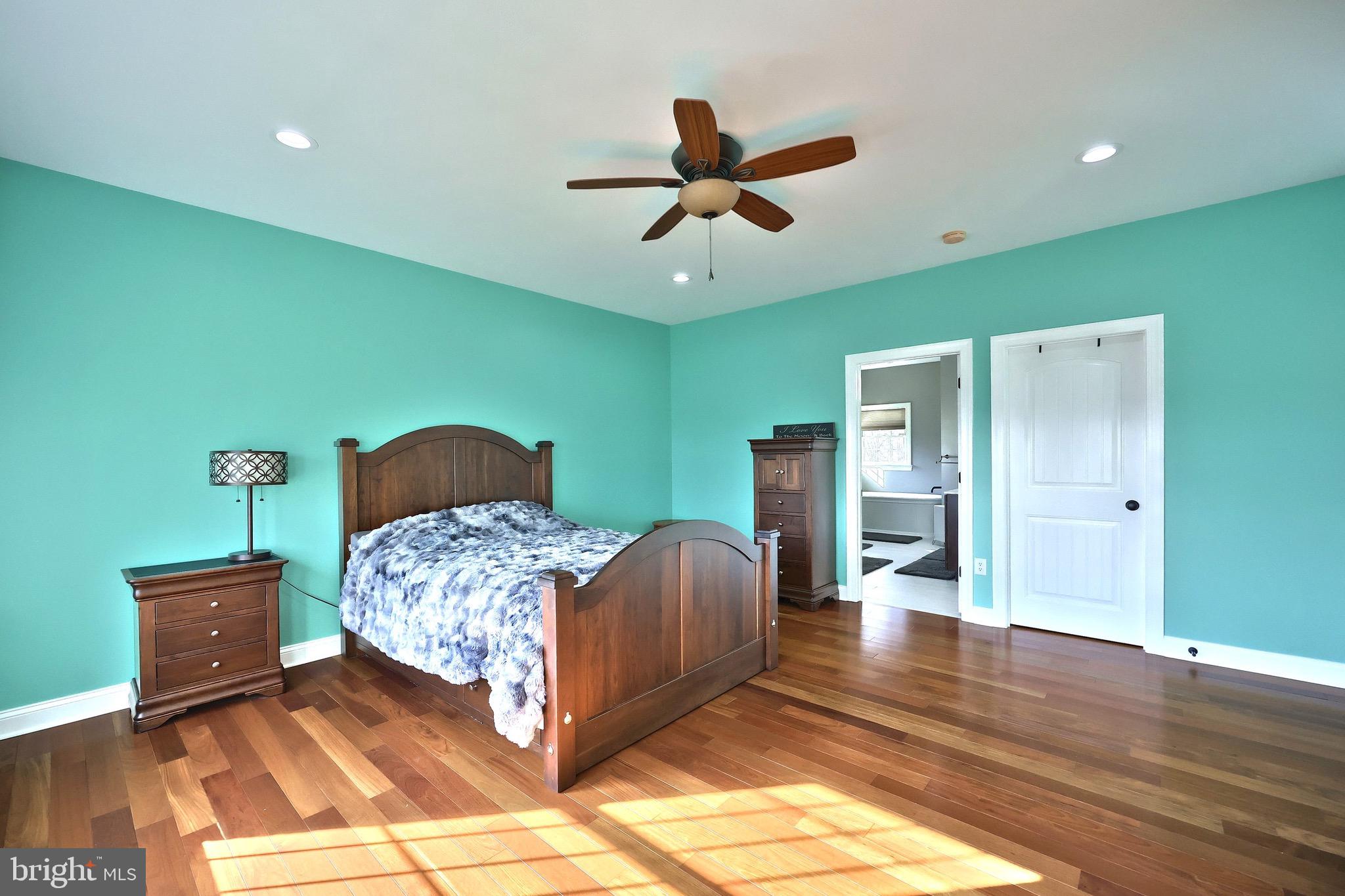 4440 Beards School Road Spring Grove, PA 17362 - Photo 10 of 66 a bedroom with a bed and a chandelier
