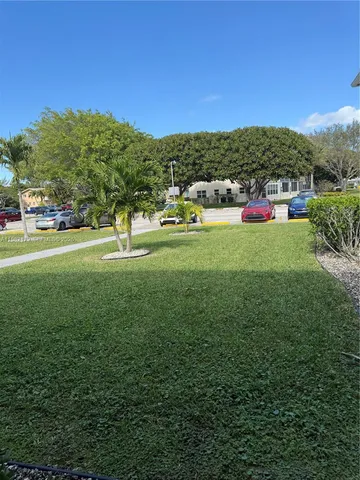 a living room with furniture and outdoor space