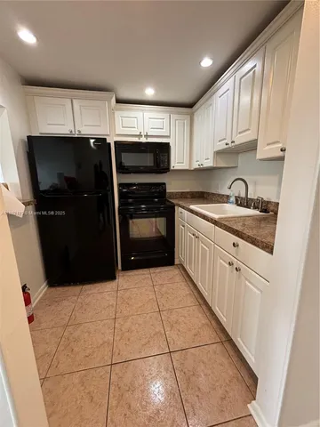 a view of a swimming pool with front yard