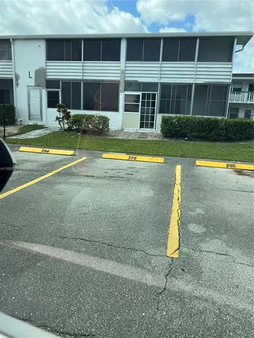 a view of a park with large trees