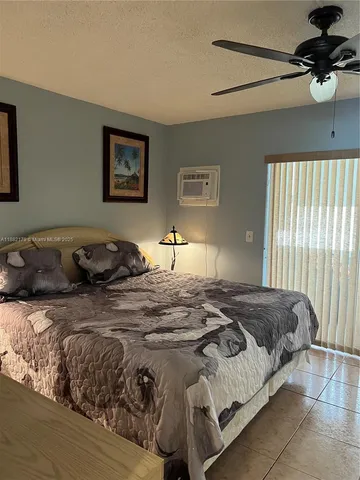 a view of a house with a yard potted plants