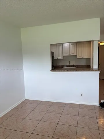 a bathroom with a granite countertop toilet sink and shower