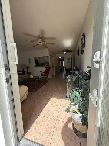 a view of a house with a yard potted plants