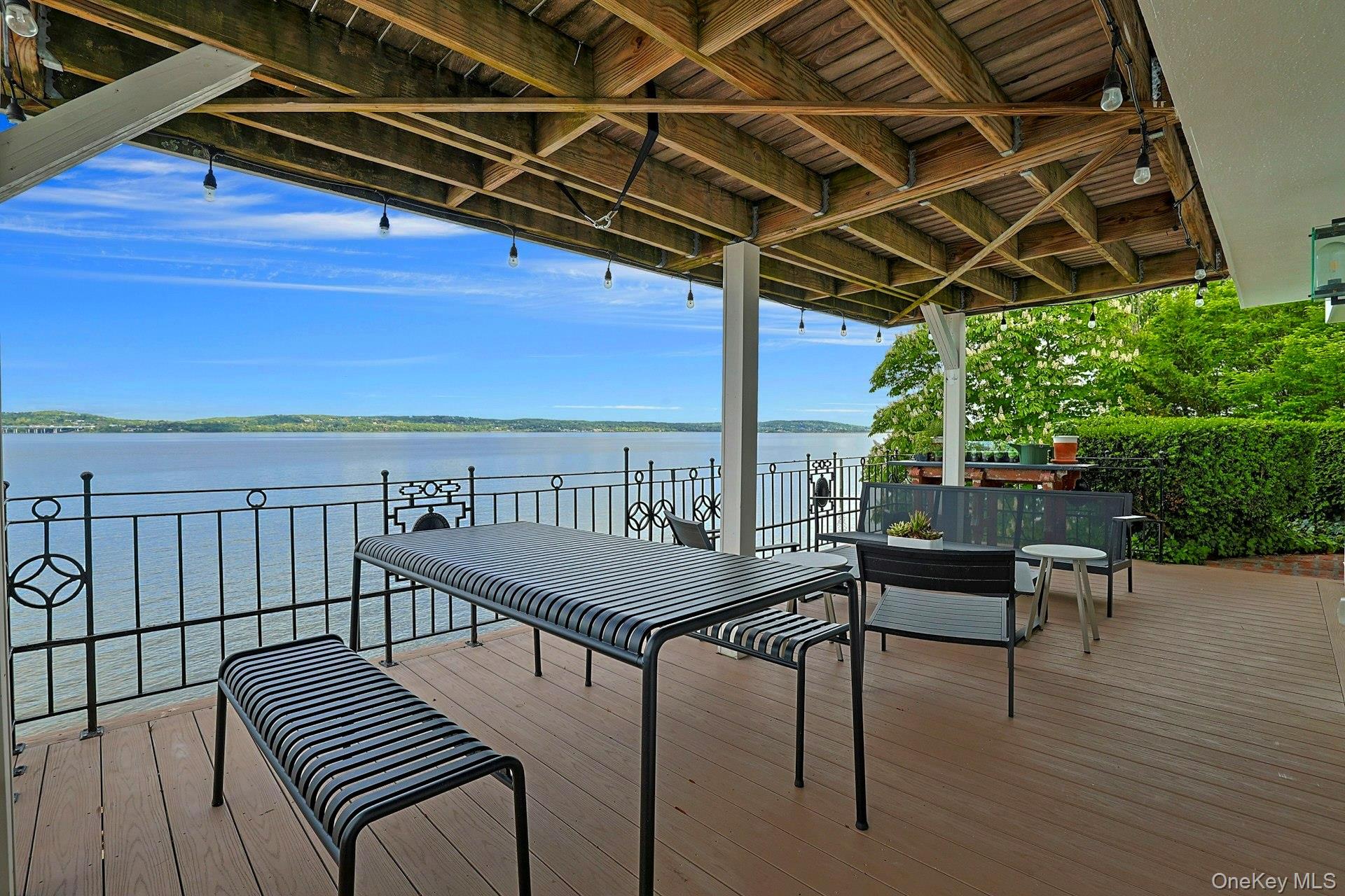 88 River Road Nyack, NY 10960 - Photo 17 of 49 a view of a balcony with table and chairs