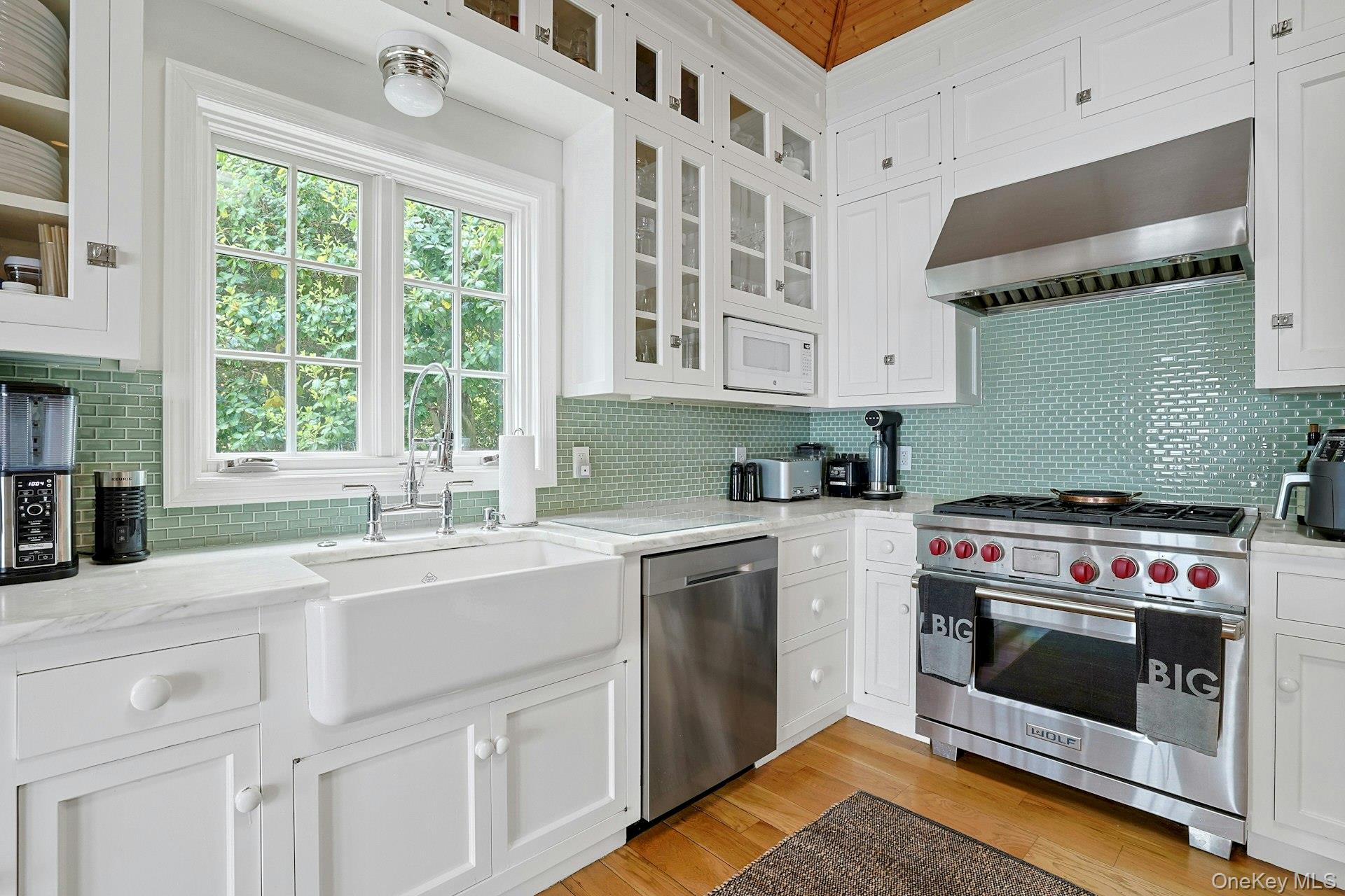 88 River Road Nyack, NY 10960 - Photo 28 of 49 a kitchen with a stove a sink and a microwave