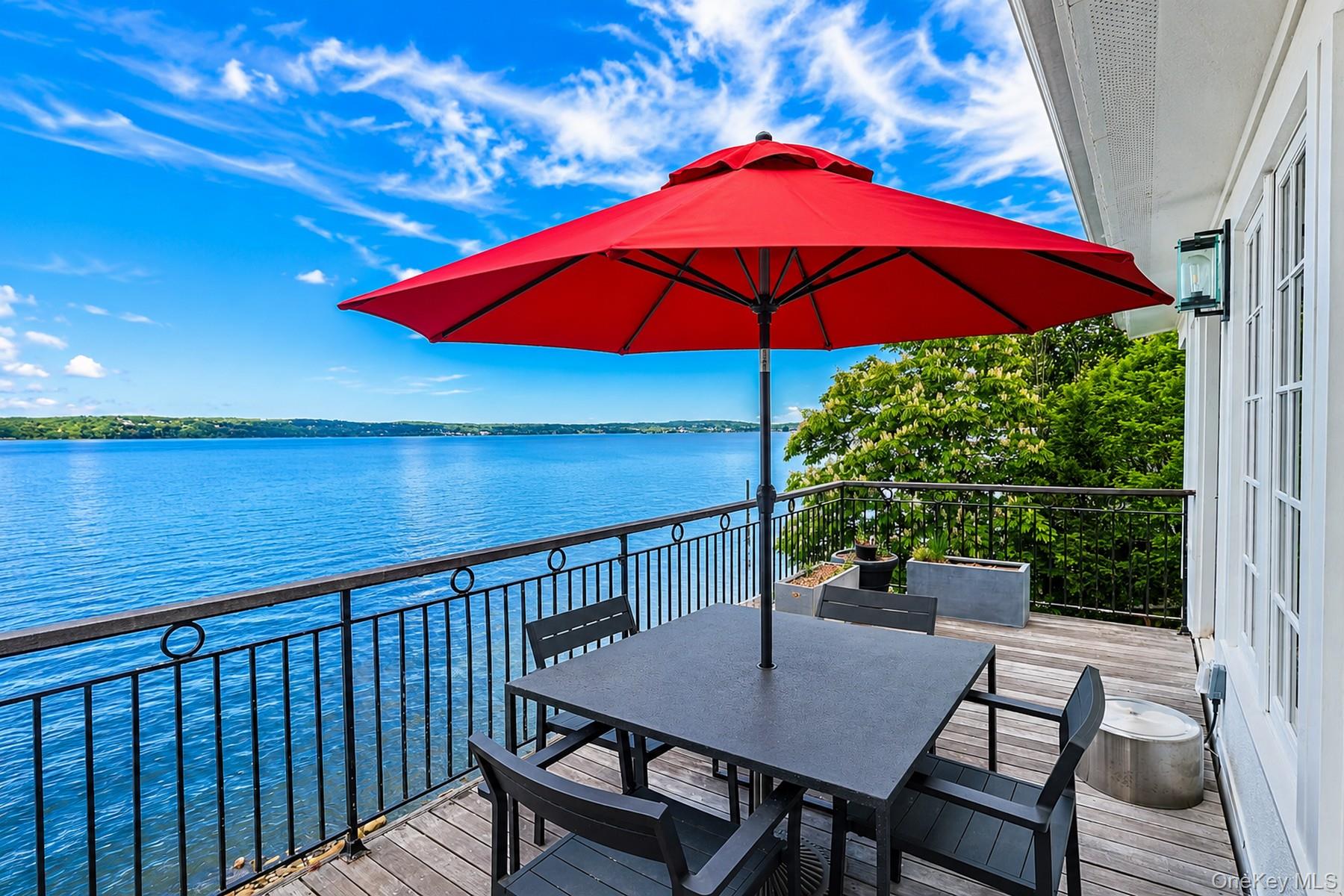 88 River Road Nyack, NY 10960 - Photo 3 of 49 a view of balcony with furniture and umbrella