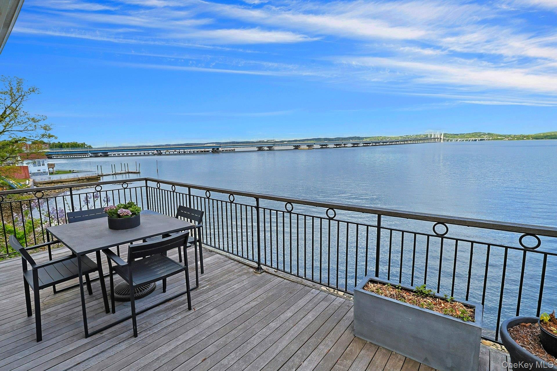 88 River Road Nyack, NY 10960 - Photo 34 of 49 a view of a balcony with wooden floor table and chairs