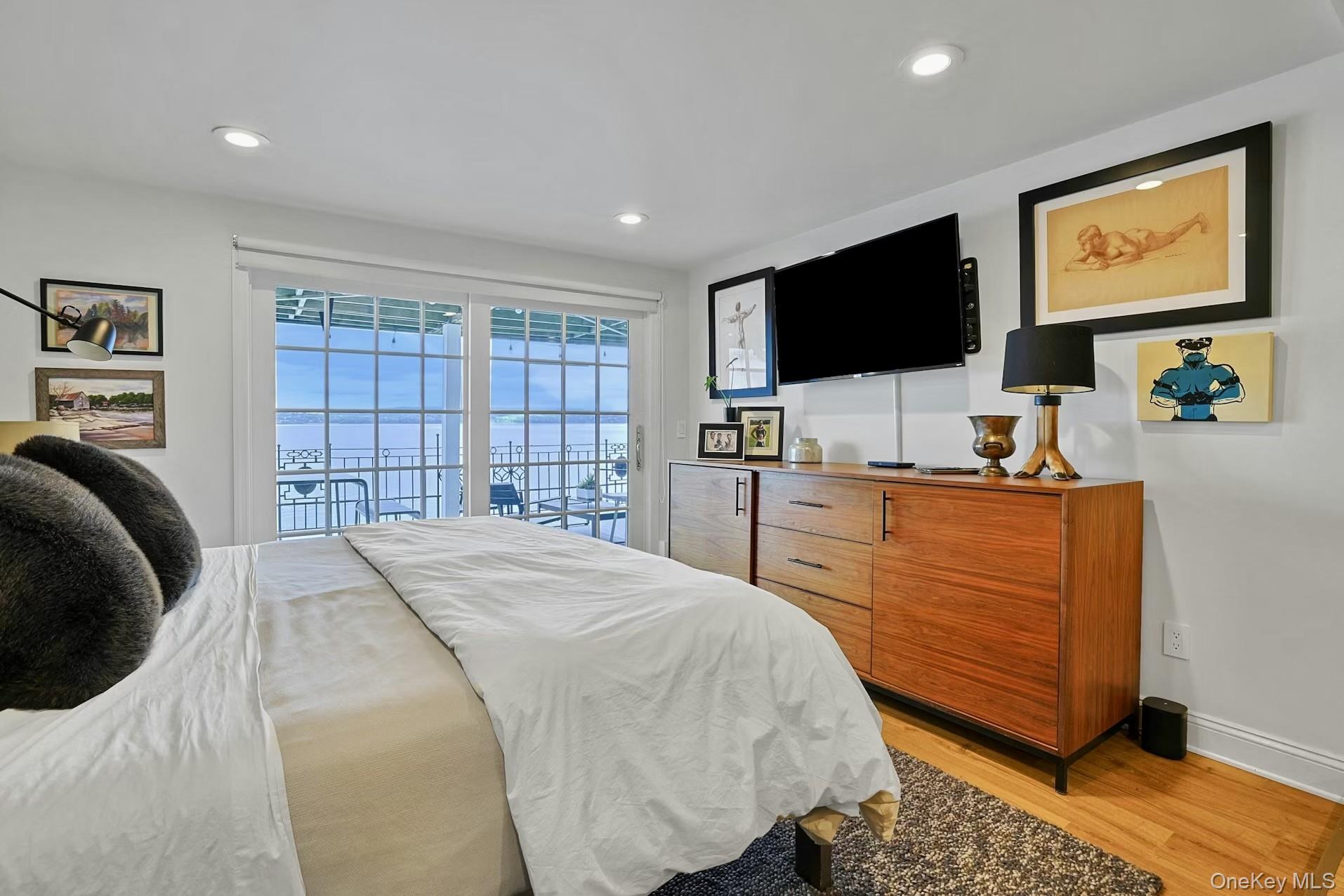 88 River Road Nyack, NY 10960 - Photo 37 of 49 a bedroom with a bed and a flat screen tv
