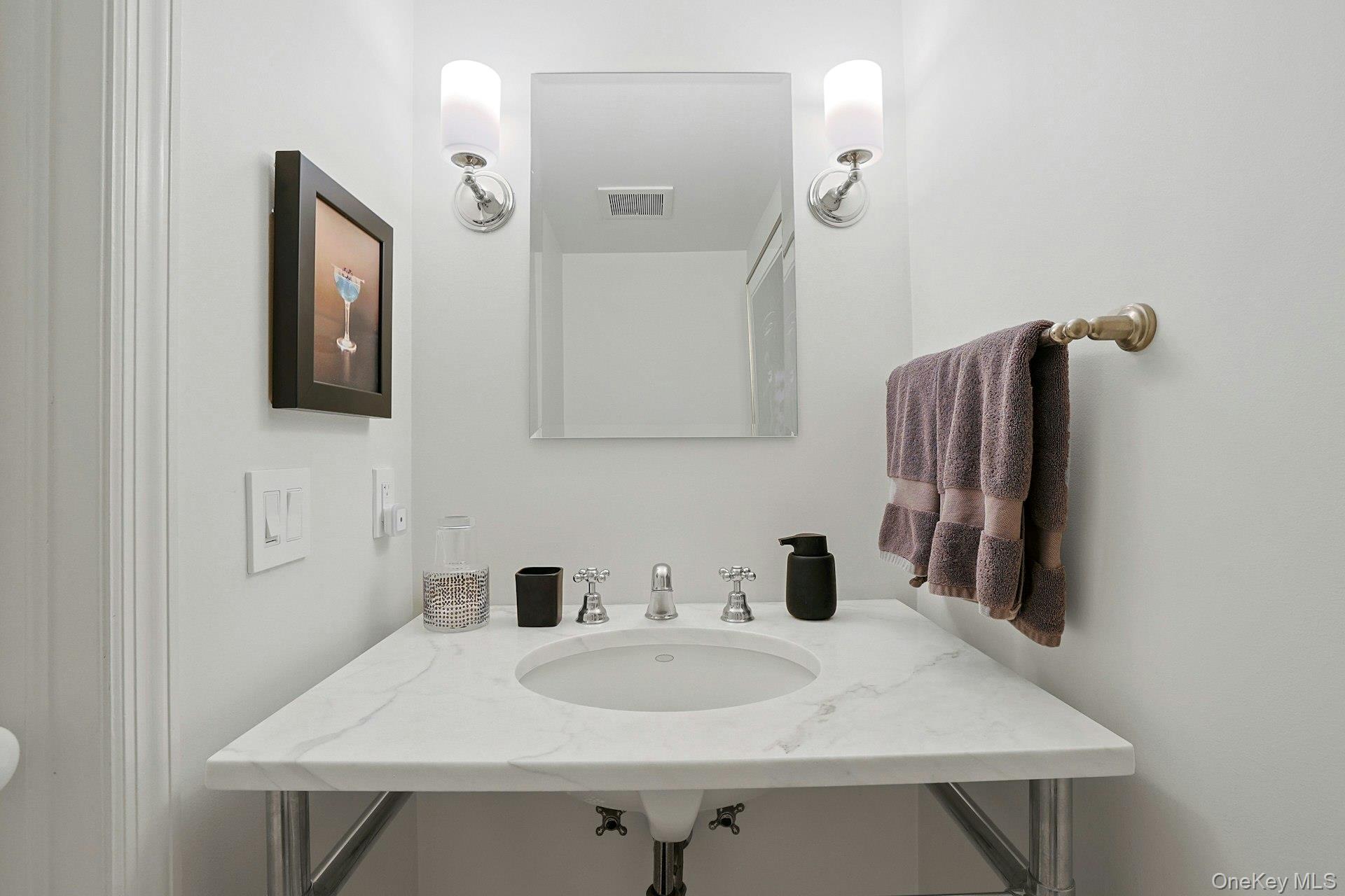 88 River Road Nyack, NY 10960 - Photo 39 of 49 a bathroom with a sink and a mirror