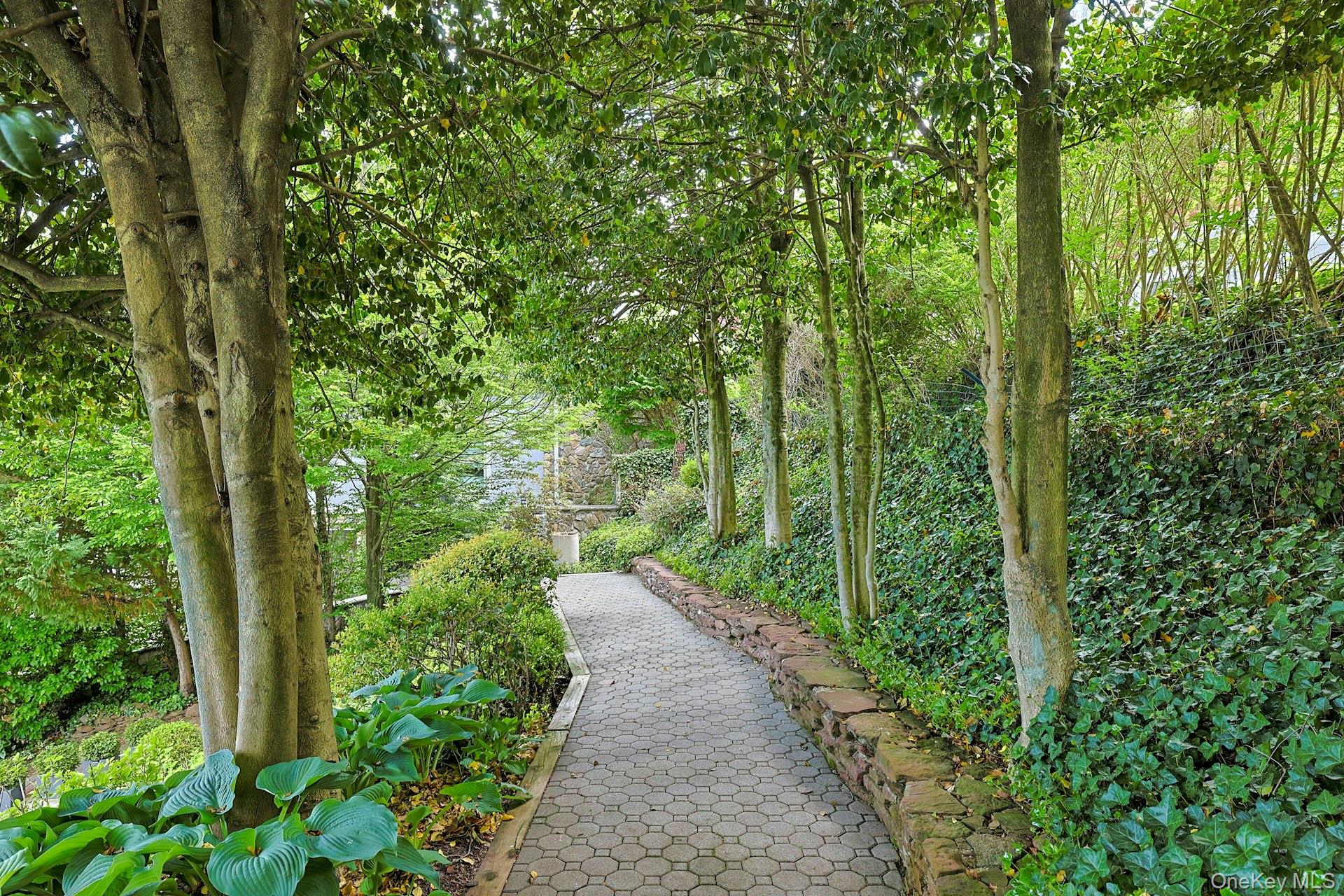 88 River Road Nyack, NY 10960 - Photo 4 of 49 a view of a pathway both side of yard