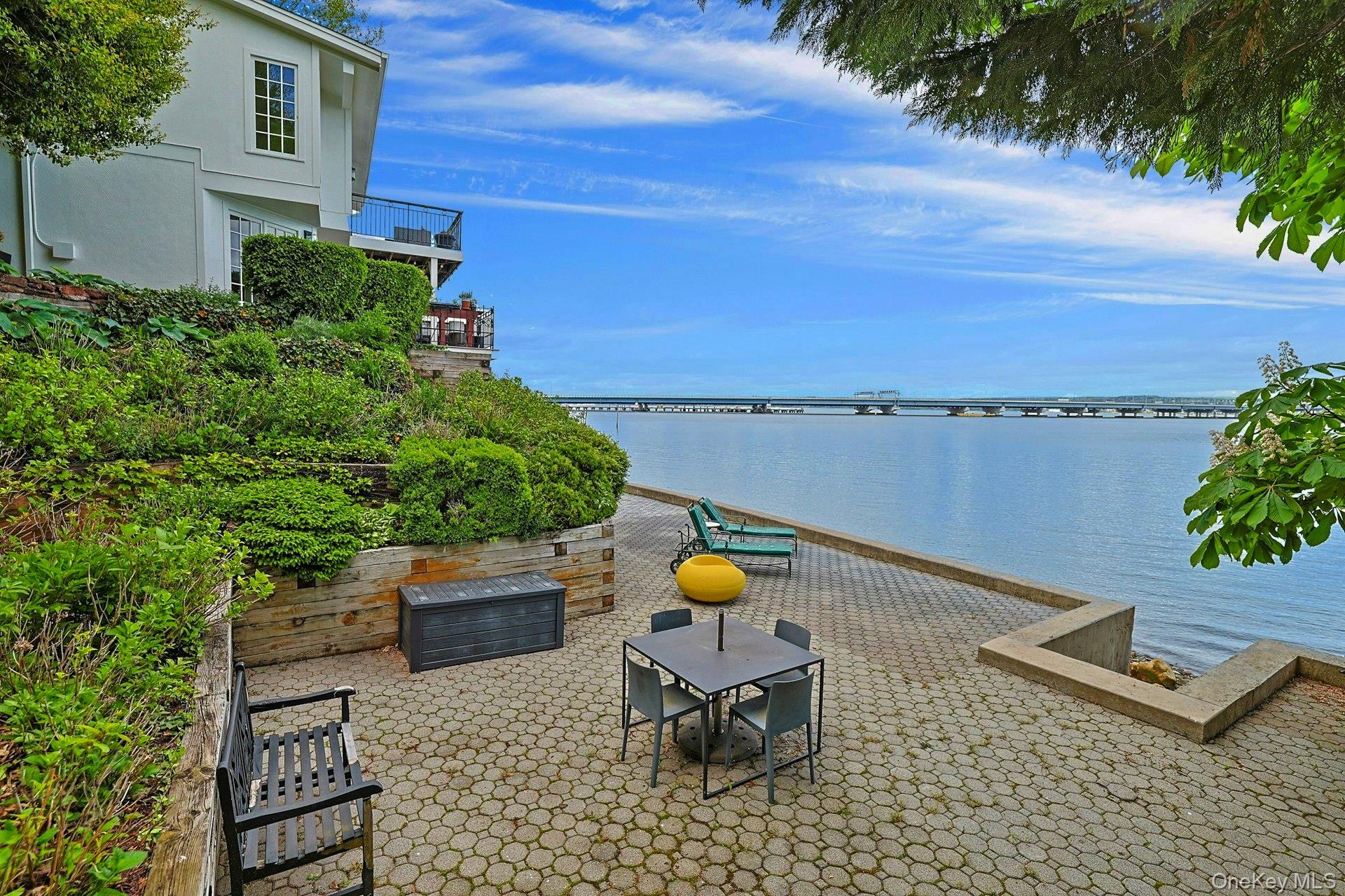 88 River Road Nyack, NY 10960 - Photo 8 of 49 a view of a chairs and table on the terrace