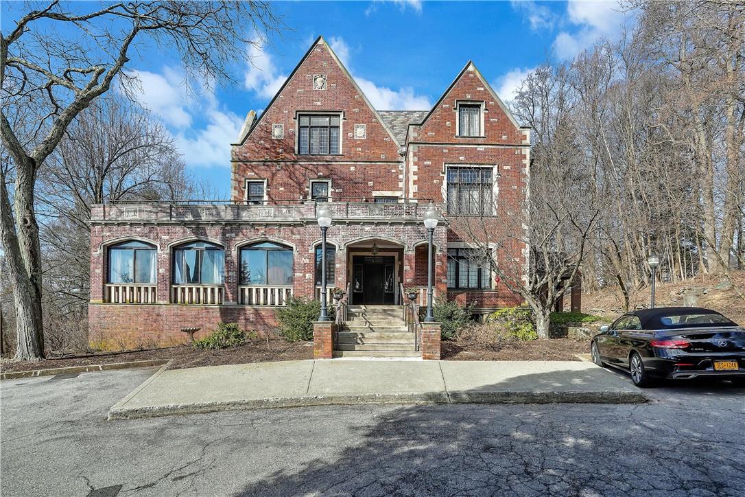 3 Beecher Lane, Unit 4B Peekskill, NY 10566 - Photo 1 of 1 a front view of a house with a yard and garage