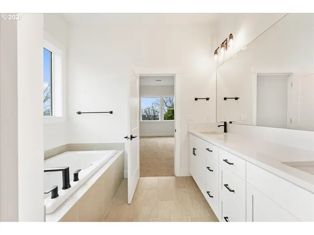 a bathroom with a sink mirror toilet and shower