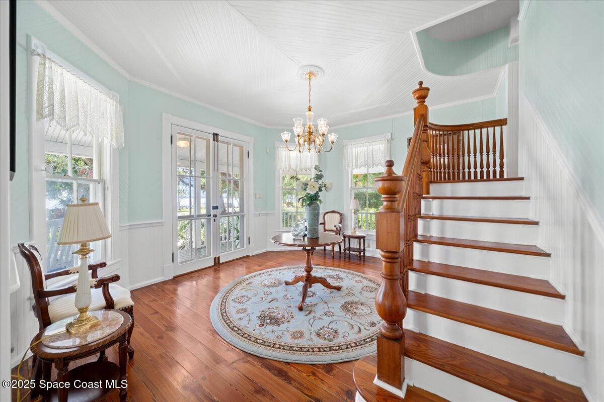607 Rockledge Drive Rockledge, FL 32955 - Photo 11 of 91 a living room with furniture and a chandelier