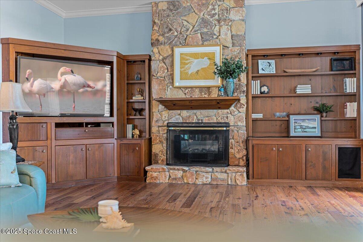 607 Rockledge Drive Rockledge, FL 32955 - Photo 23 of 91 a living room with furniture a fireplace and a flat screen tv