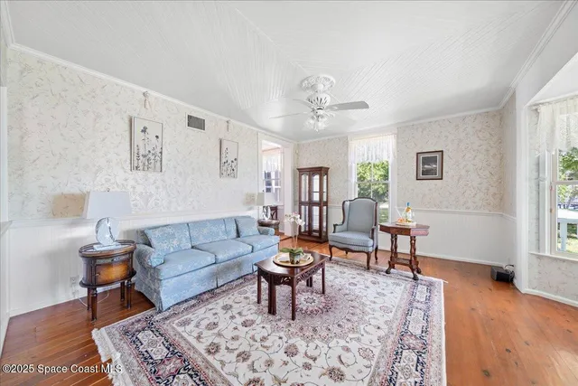 a living room with a fireplace and a window