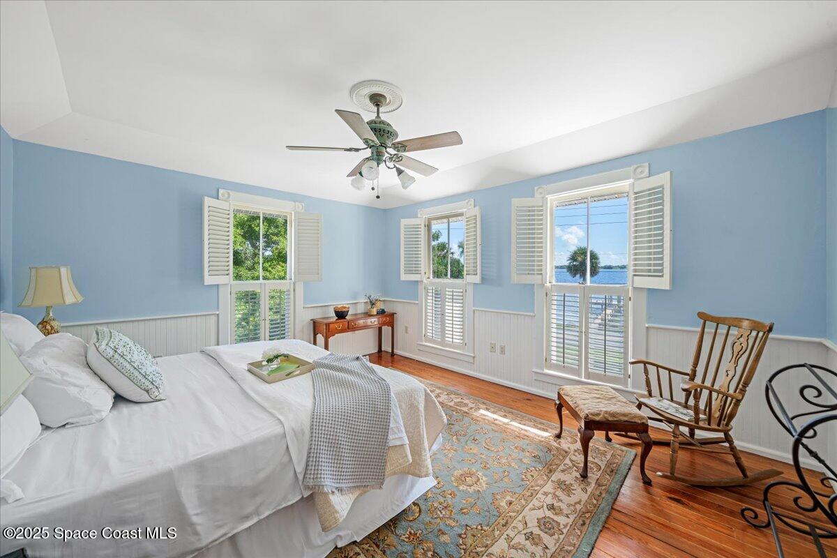 607 Rockledge Drive Rockledge, FL 32955 - Photo 29 of 91 a bedroom with a bed and a table chair