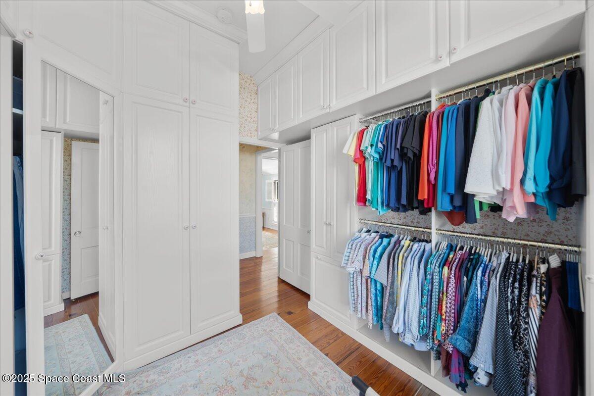 607 Rockledge Drive Rockledge, FL 32955 - Photo 32 of 91 a view of walk in closet with clothes and shoes