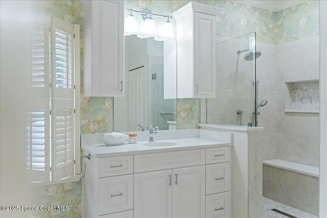 a backyard of a house with a garden and tree