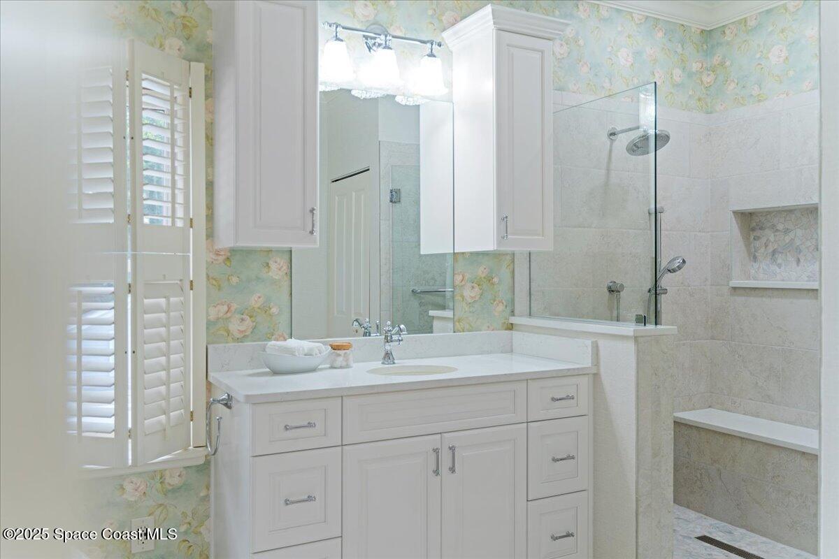 607 Rockledge Drive Rockledge, FL 32955 - Photo 36 of 91 a bathroom with a shower sink and mirror