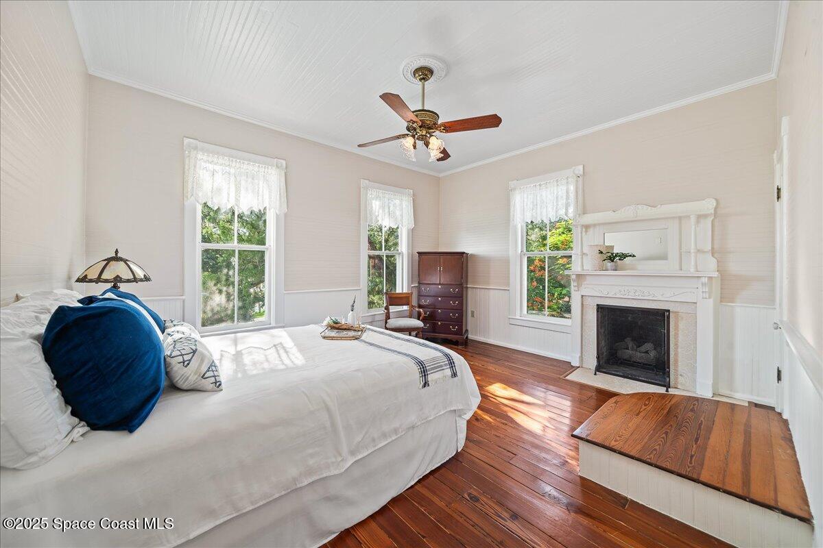 607 Rockledge Drive Rockledge, FL 32955 - Photo 38 of 91 a bedroom with a bed and a fireplace