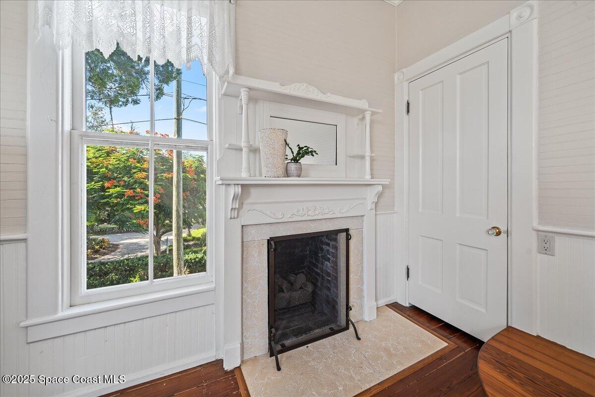 607 Rockledge Drive Rockledge, FL 32955 - Photo 40 of 91 a living room with a fireplace and a window