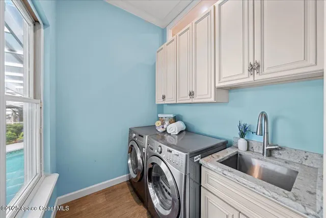 an aerial view of ocean with residential house with outdoor space