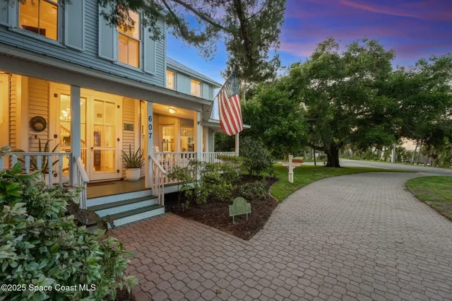 a living room with fireplace furniture and a table