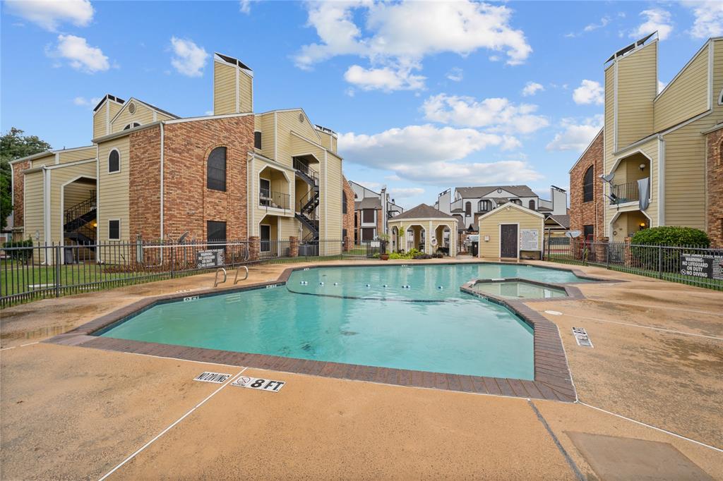 4434 Point Boulevard, Unit 108 Garland, TX 75043 - Photo 13 of 13 a view of multiple house with a swimming pool