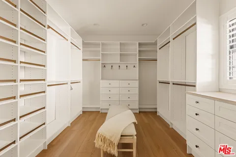 a bed room with a bed and a cabinets