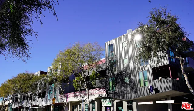 a view of balcony with yard and outdoor seating