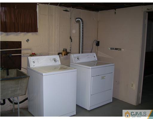 29 Burnham Road East Brunswick, NJ 08816 - Photo 14 of 14 a utility room with dryer and washer