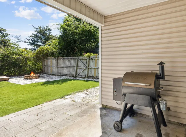 a view of backyard with outdoor seating