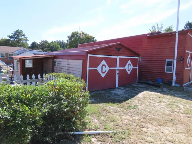 a sign broad in front of a brick building