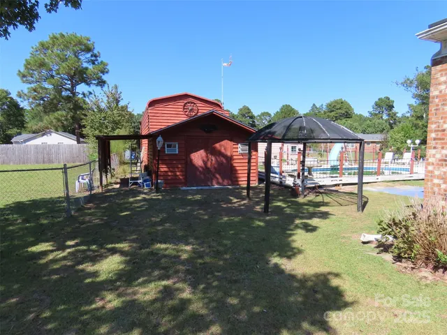 a view of a large house with a swimming pool